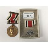 A Special Constabulary medal to Sergeant Norman W B Macmillan, together with a rank badge