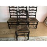 A set of four ladder back chairs with rush seats