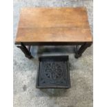 A small carved stool together with another in oak