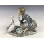 A Lladro figurine of a girl with ducks