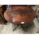 A reproduction mahogany occasional table