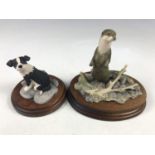 Two Border Fine Arts figurines depicting an otter and a collie dog