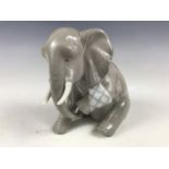 A Lladro 'Painful Elephant' figurine from the Painful Animals series by Juan Huerte, retired 1981