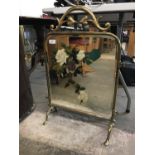 A brass and mirrored fire screen (a/f)