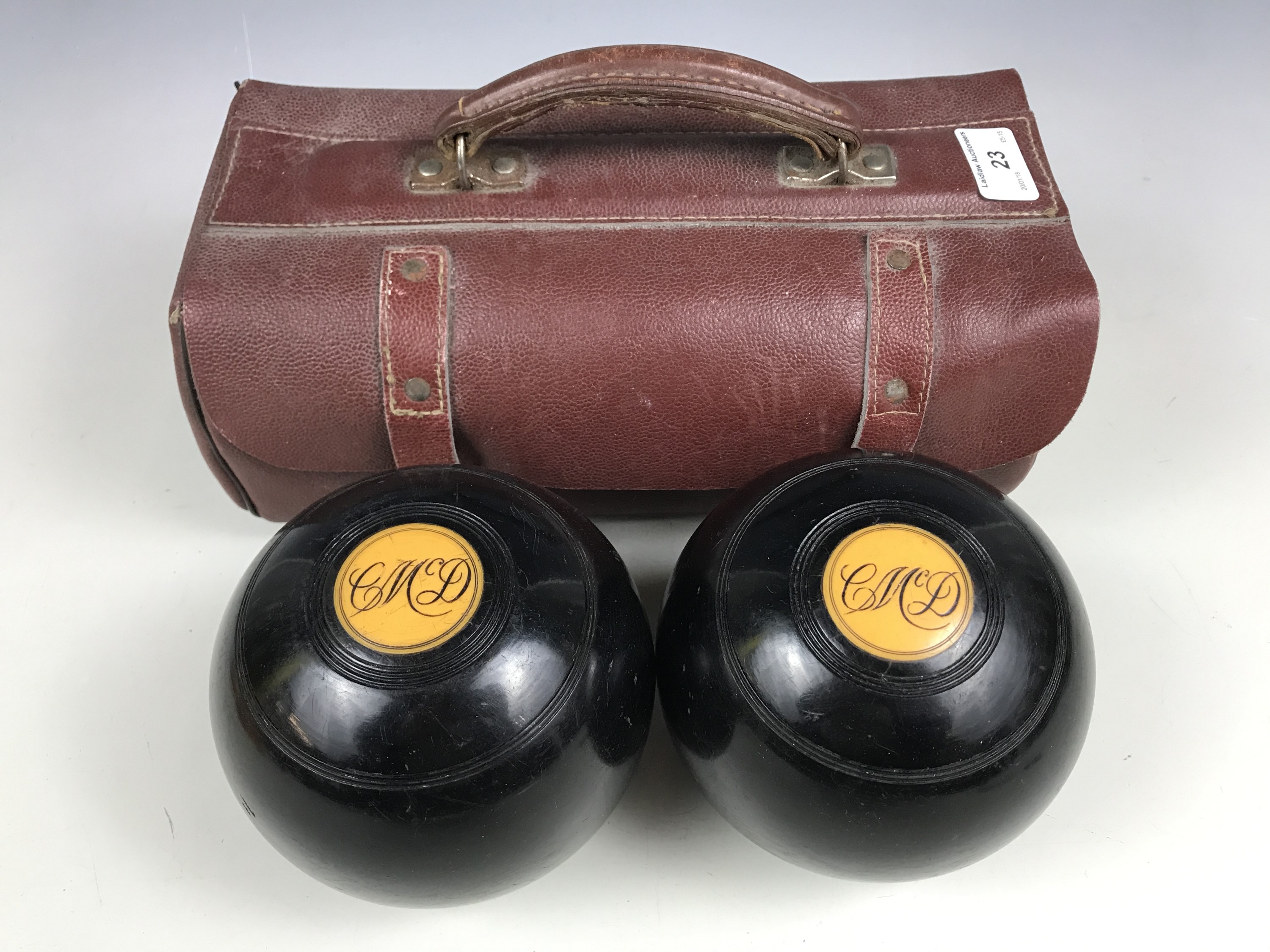 A cased pair of bowling woods