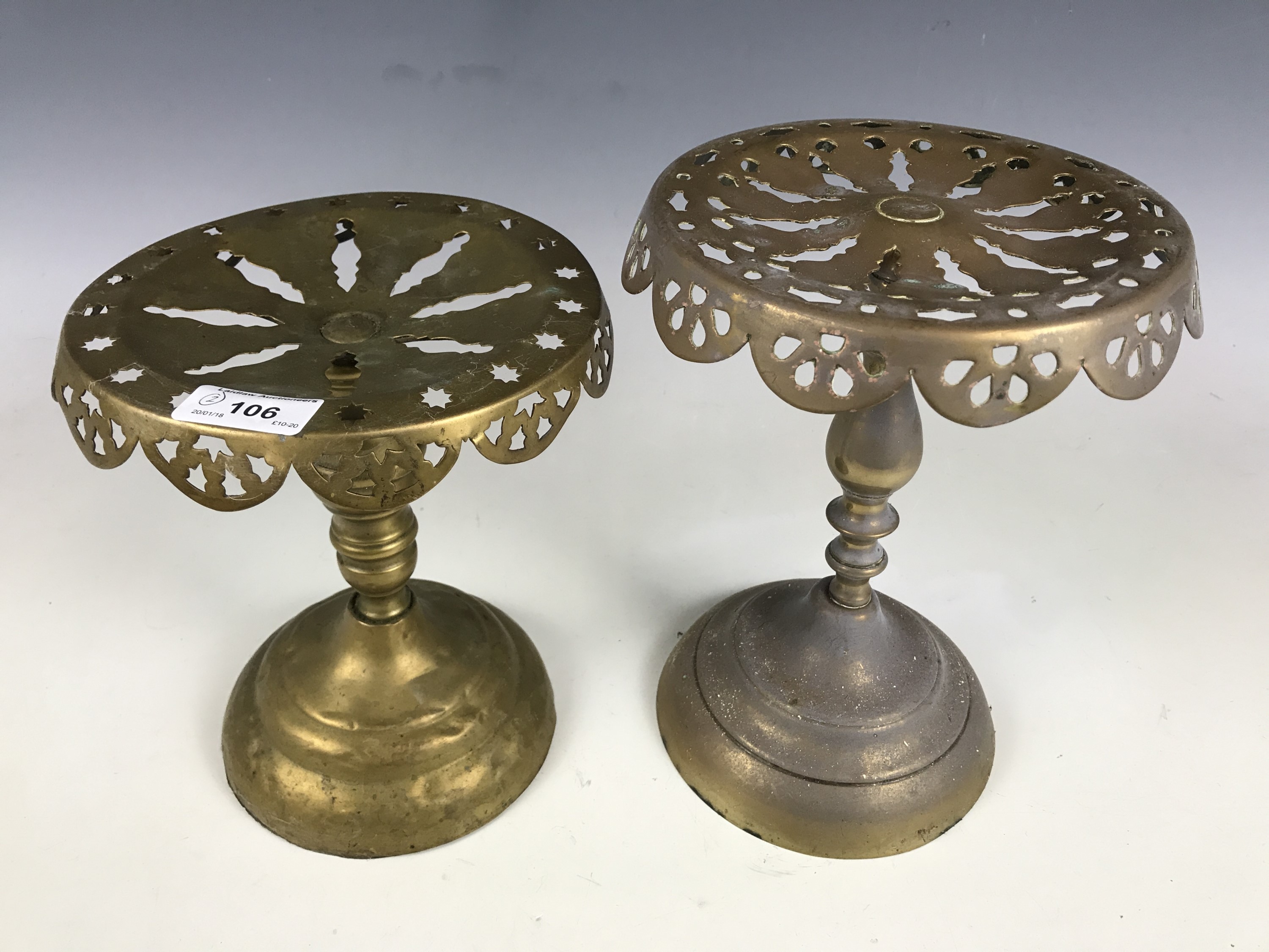 Two brass trivets