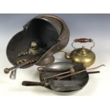 A Victorian copper coal helmet together with a brass kettle, Scottish thistle pattern hearth