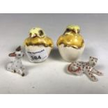 A pair of novelty cruets in the form of chicks, and two ceramic animals