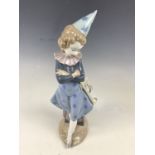 A Lladro figurine modelled as a clown with trumpet, E22J