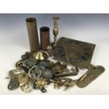 A quantity of brassware including a brass mask / face, horse brasses etc