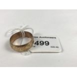 A 9ct gold wedding band with foliate engraving