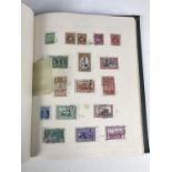 A stamp album containing Australian and Canadian stamps etc