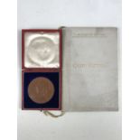 A Queen Victoria diamond jubilee medallion together with a privately published 1901 Bucklebury Queen