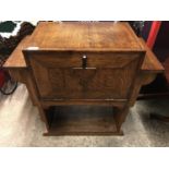 A 1930's oak diminutive cabinet