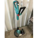 A Bosch cordless strimmer with charger