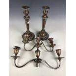 A pair of old Sheffield plate candlesticks together with two other branched candle holders