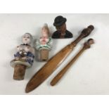 Two novelty bottle stoppers together with a treen owl paper knife etc