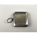 A silver vesta case