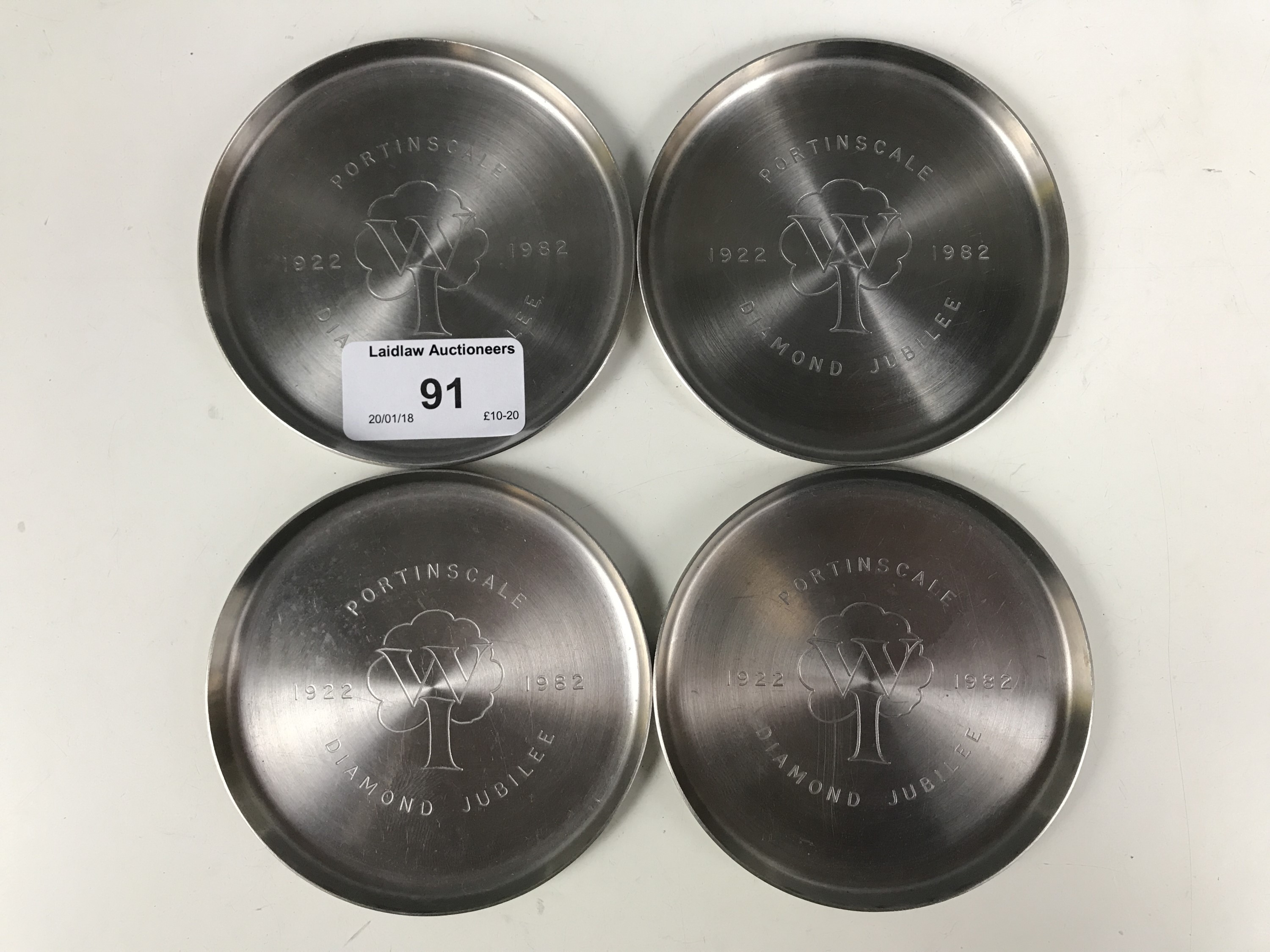 Four Keswick School of Industrial Art engraved coasters commemorating the Portinscale W.I. Diamond