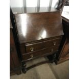 A 1940's oak two-drawer bureau