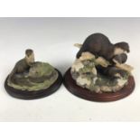 A Border Fine Arts figurine depicting otters together with one other