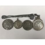 Coins including a Maria Theresa Thaler, a United States 1966 half dollar in a pendant mount, a