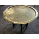 An Egyptian brass-topped table