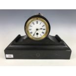 A Victorian polished black slate mantel clock of drum form