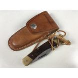 A 970 Puma Game Warden lock knife in pouch