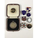 A silver and enamel button for fifty years loyalty from the Amalgamated Society of Woodworkers,