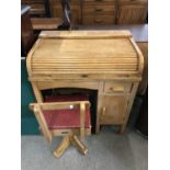 A 1950's Taylor of Leicester child's roll top desk together with swivel chair