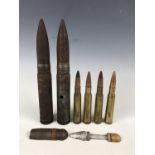Four inert .50 calibre rounds, two large calibre canon rounds and a skeletonised canon round, (