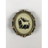 A Victorian pivoting double locket brooch containing a carved bone vignette of a prancing horse, 6