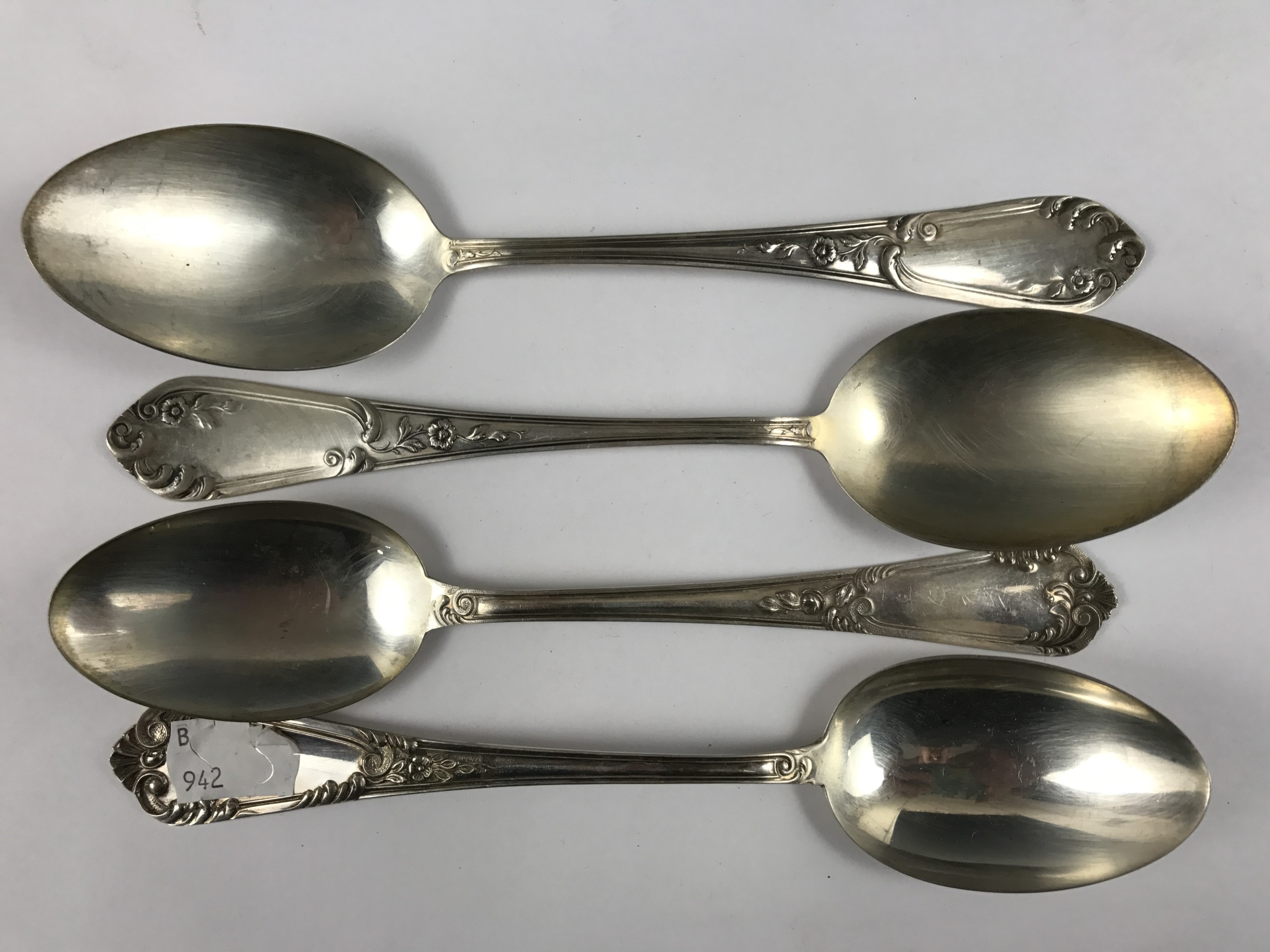 Four white metal table spoons, three stamped '800', 178g