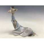 A Lladro 'Painful Giraffe' figurine from the Painful Animals series by Juan Huerte, retired 1981 (