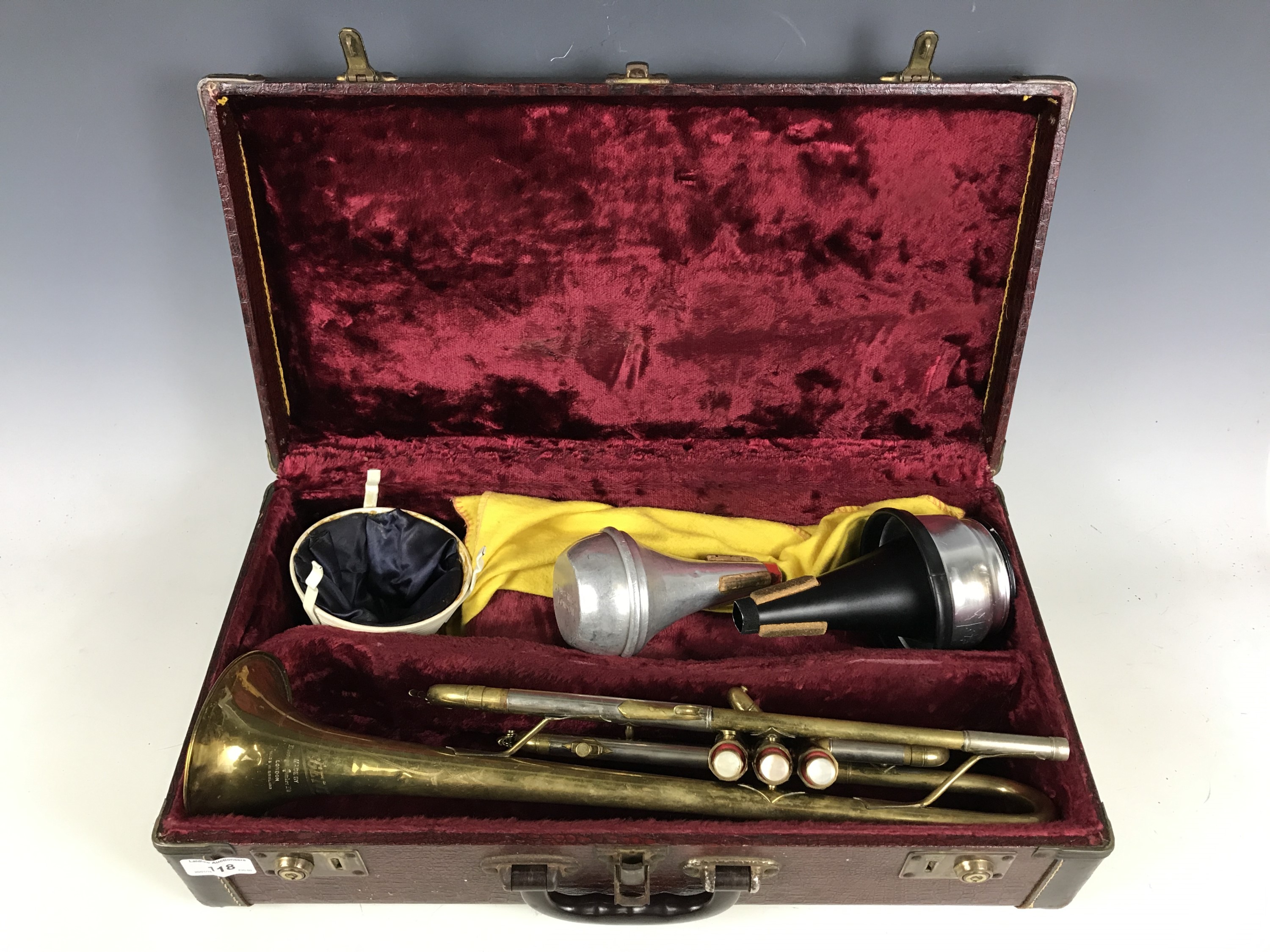 A cased Boosey and Hawkes Regent trumpet with mutes