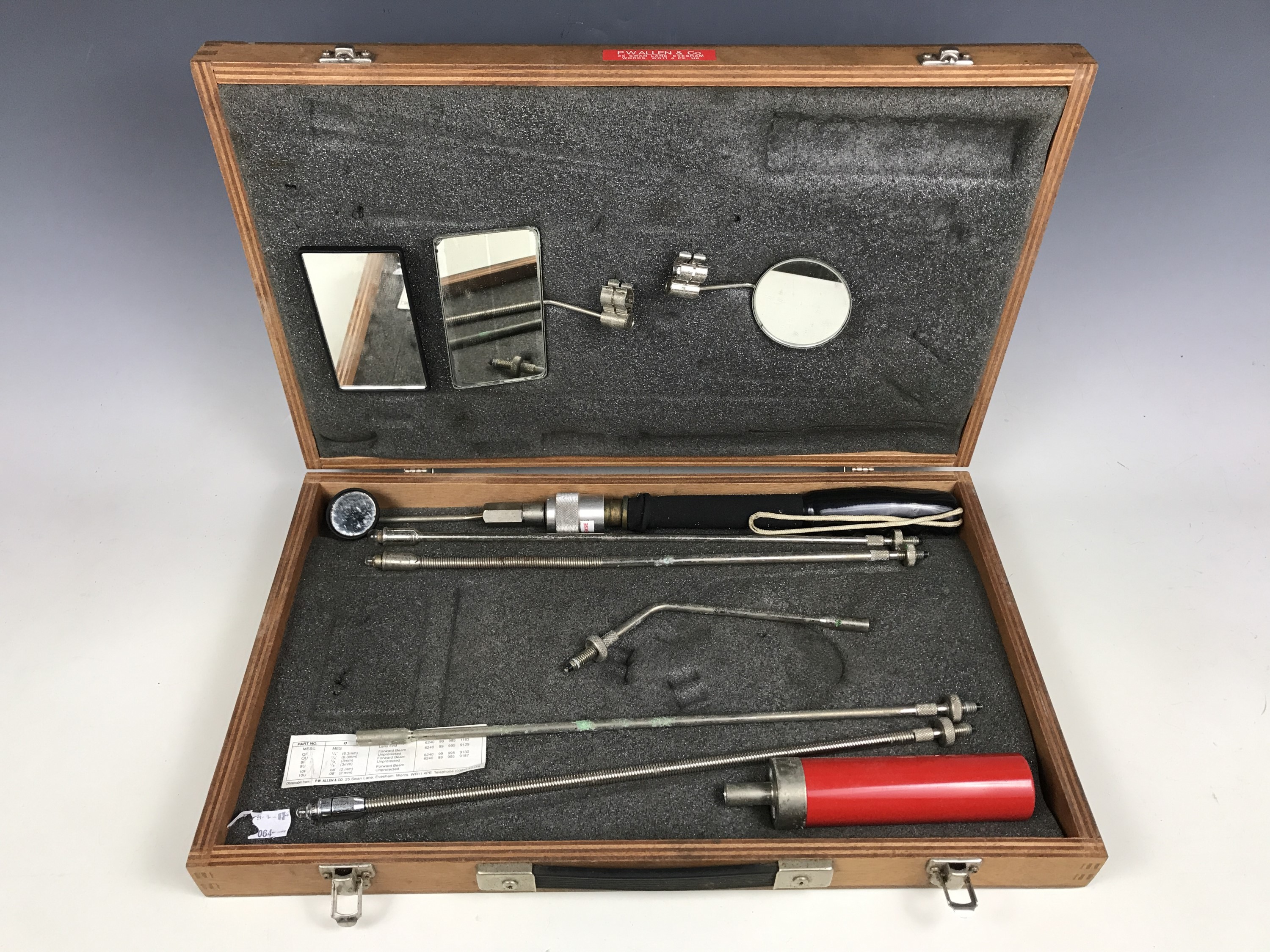 A vintage wooden cased inspection kit by P. Wallen & Co