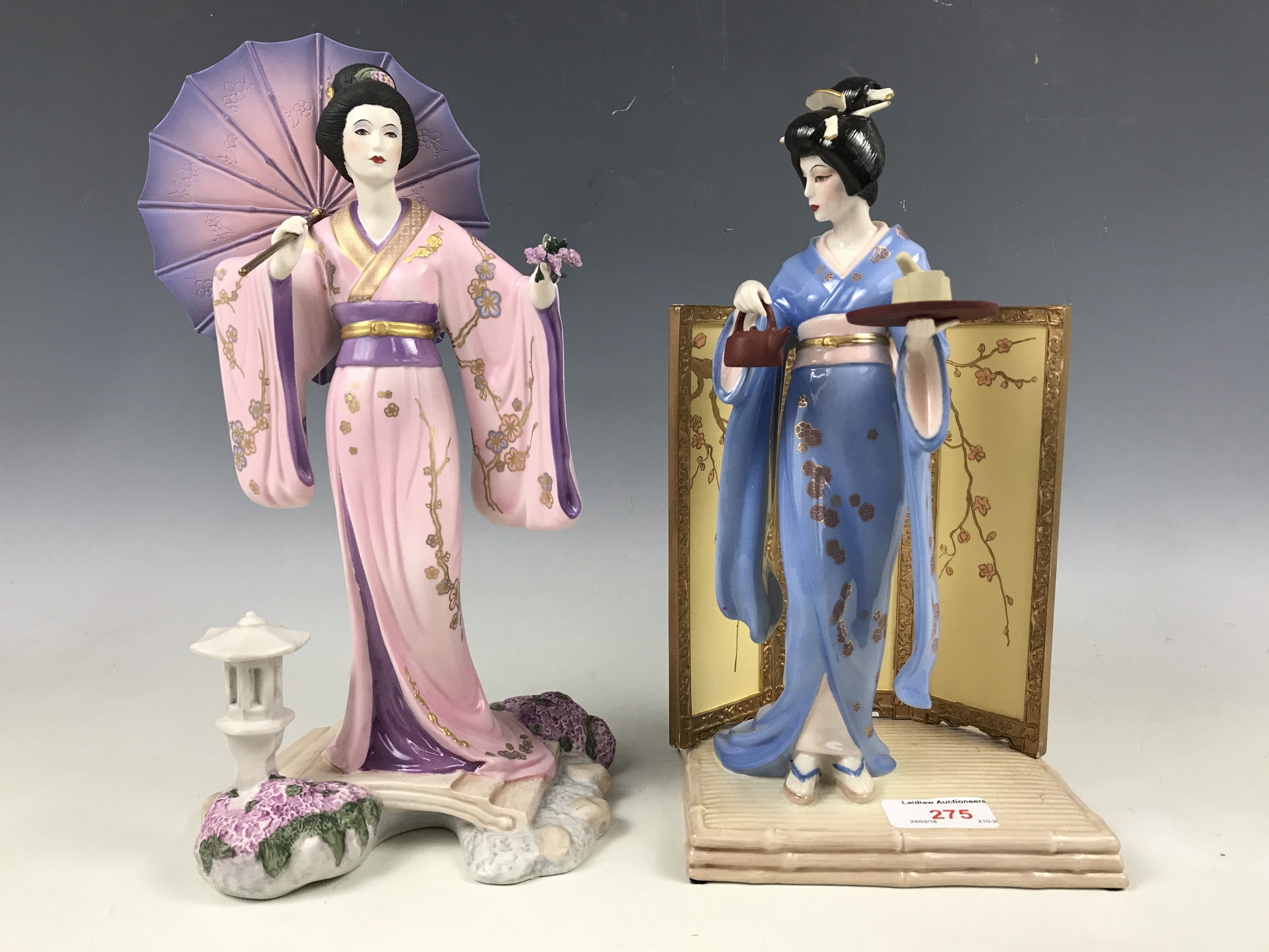 Two Japanese ceramic figurines modelled as Yoshiko and Tamiko