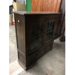 A lead glazed oak bookcase / cabinet, 114 x 114 cm