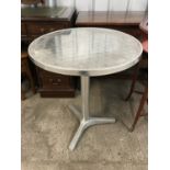 A contemporary galvanized garden table