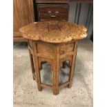 An early 20th Century Indian brass-inlaid Damascus style table