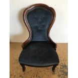 A Victorian mahogany nursing chair