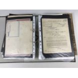 A ring binder containing a quantity of varied military ephemera