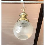 An early 20th Century pendant brass ceiling light with etched glass shade