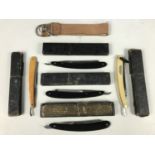 Five vintage razors together with a strop