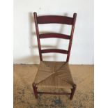 A 19th Century rush seated ladder back wagon / nursing chair