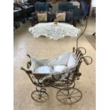 A reproduction Victorian doll's pram