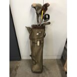 A vintage golf bag with clubs