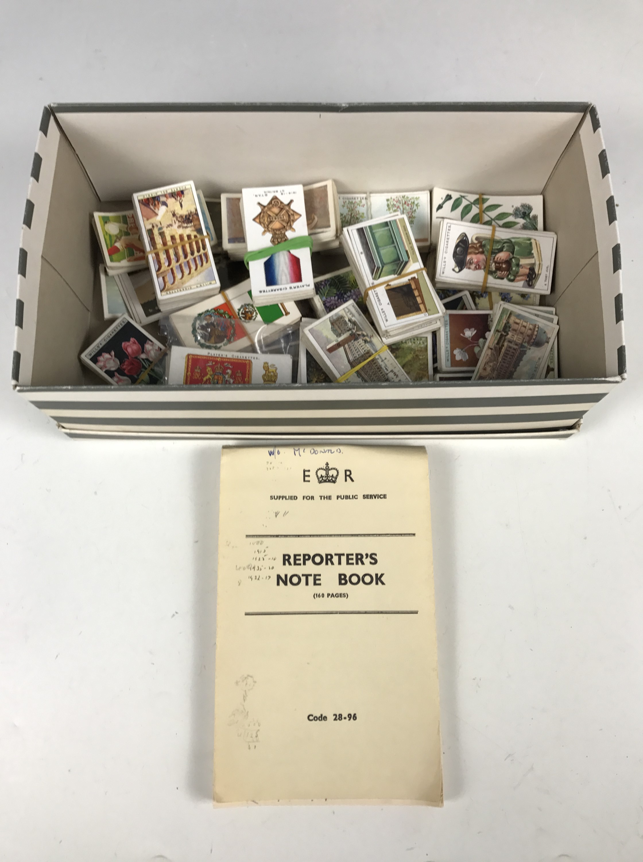 A collection of vintage Wills and Players cigarette cards, including War Decorations and Medals