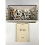 A collection of vintage Wills and Players cigarette cards, including War Decorations and Medals